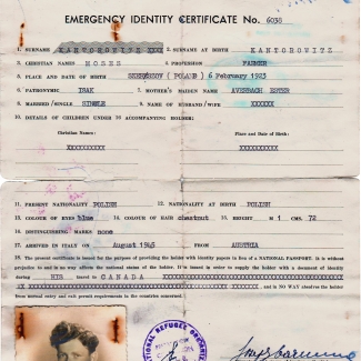 Copy of an aged yellow identity document. It contains typed text with handwritten signatures, stamps, and a black-and-white identity photograph in the bottom-left corner of a young man.
